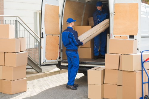 Moving team preparing a Paddington home move with boxes and furniture