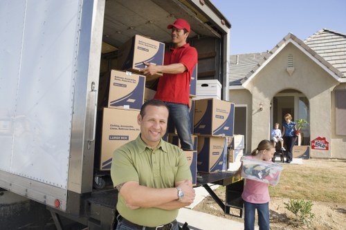 Local movers handling furniture in a Paddington flat