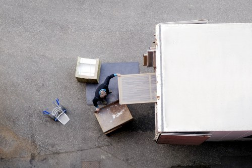 Professional movers navigating stairs in a Paddington apartment building