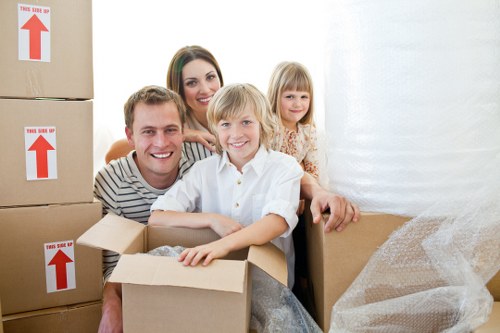 Professional removals crew handling boxes and household items in Paddington