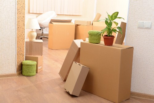 Moving boxes and household items from a Paddington apartment with stair access